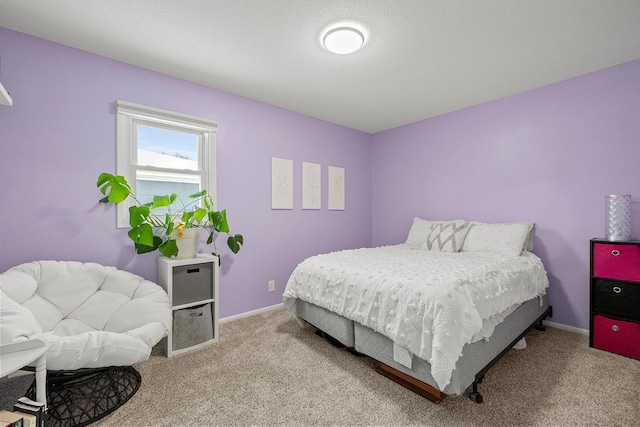 bedroom featuring light carpet