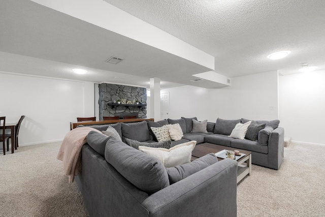 carpeted living room featuring a textured ceiling