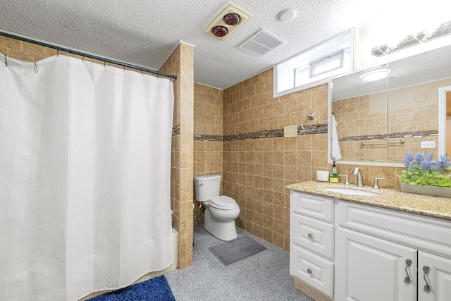 full bathroom featuring shower / tub combo with curtain, tile walls, vanity, a textured ceiling, and toilet