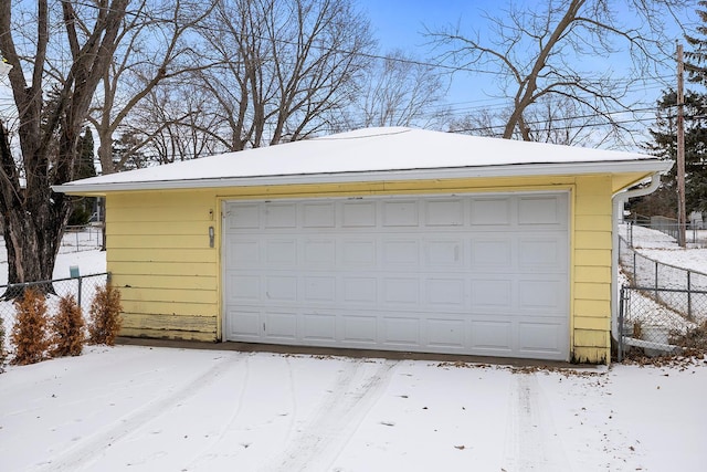 view of snow covered garage