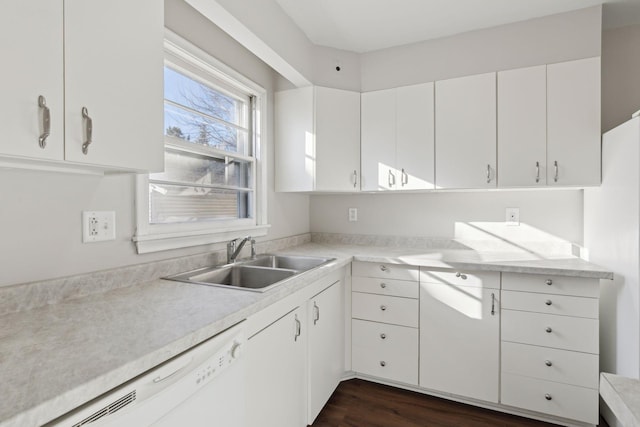 kitchen with dishwasher, sink, white cabinets, and dark hardwood / wood-style floors