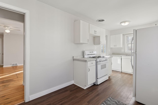 kitchen with white cabinetry, white appliances, dark wood-type flooring, and ceiling fan