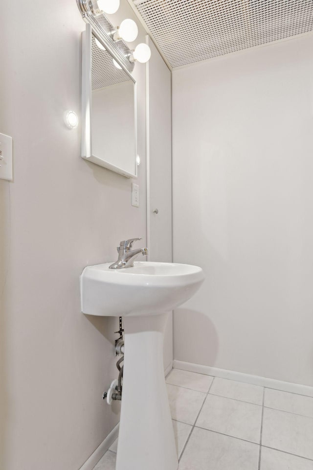 bathroom with tile patterned floors