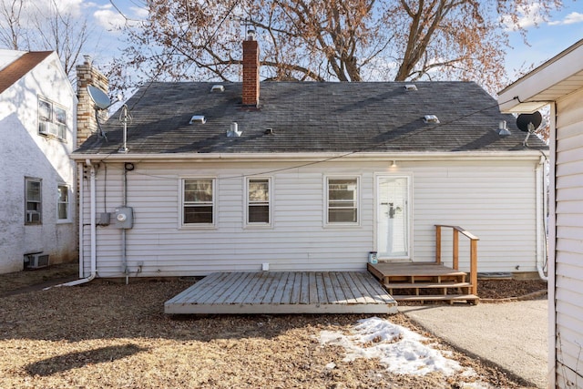 back of property with cooling unit and a deck