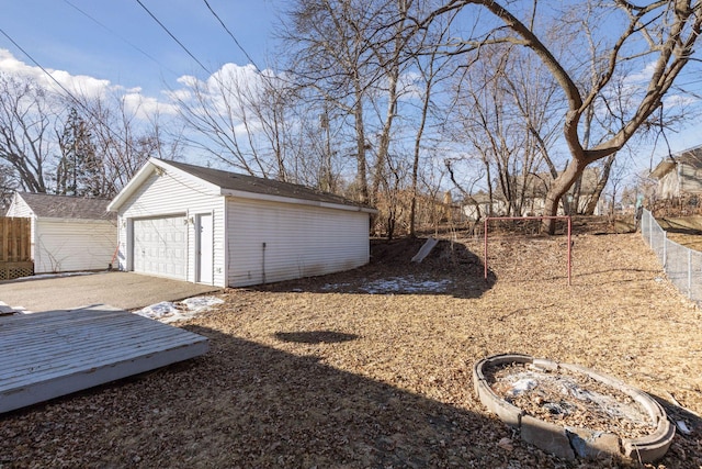 view of yard with a garage and an outdoor structure