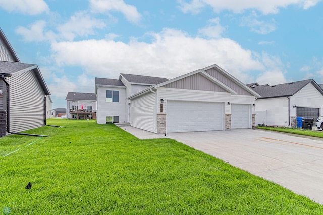 view of front of property with a garage and a front lawn