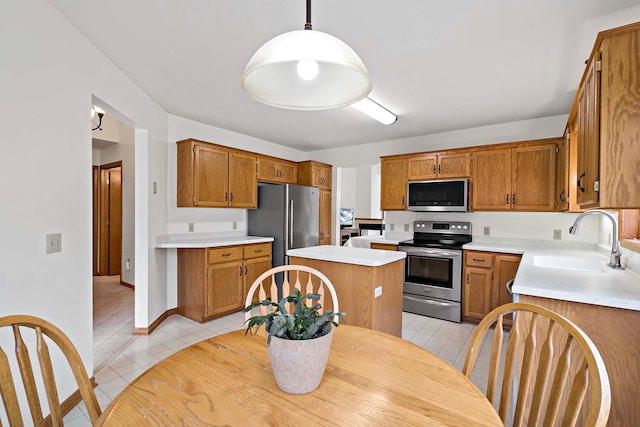 kitchen featuring a sink, appliances with stainless steel finishes, light tile patterned floors, and light countertops