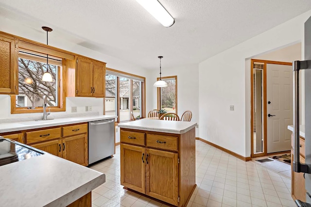 kitchen with a kitchen island, a textured ceiling, decorative light fixtures, dishwasher, and light countertops