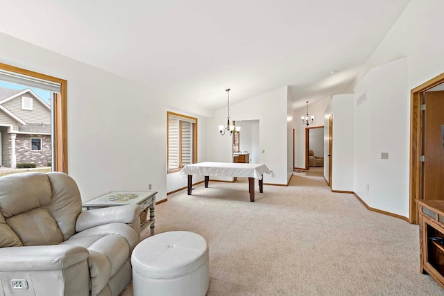 living room featuring light colored carpet, baseboards, lofted ceiling, and a chandelier