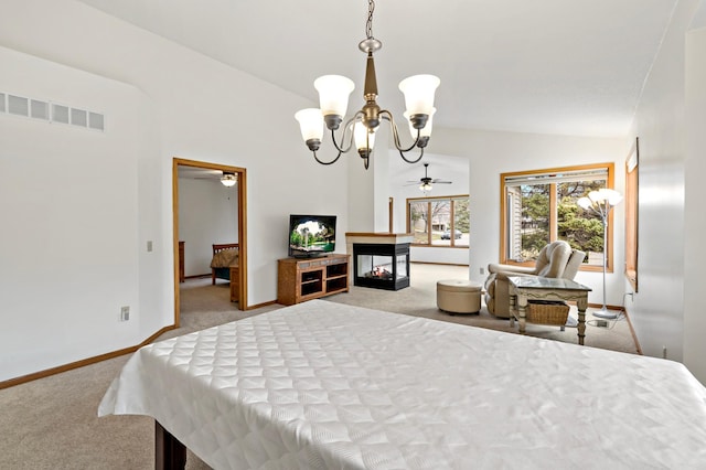 carpeted bedroom featuring a chandelier, baseboards, visible vents, and lofted ceiling