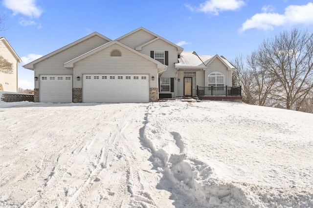 view of front of house featuring a garage and brick siding