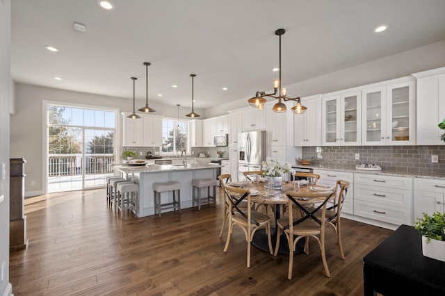 dining area featuring dark wood finished floors and recessed lighting