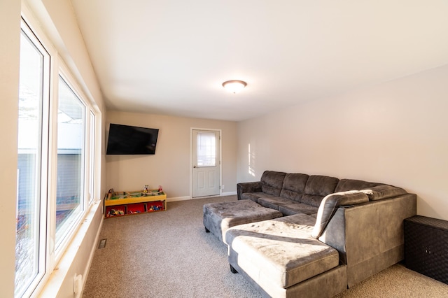 living room featuring light carpet