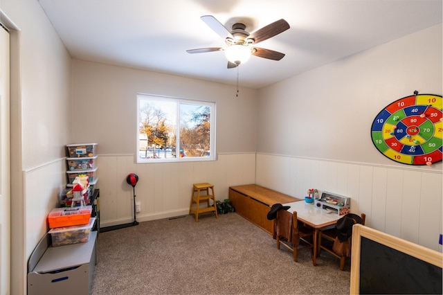 rec room featuring ceiling fan and carpet flooring