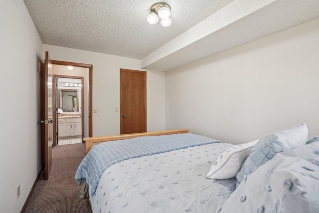 carpeted bedroom with a textured ceiling