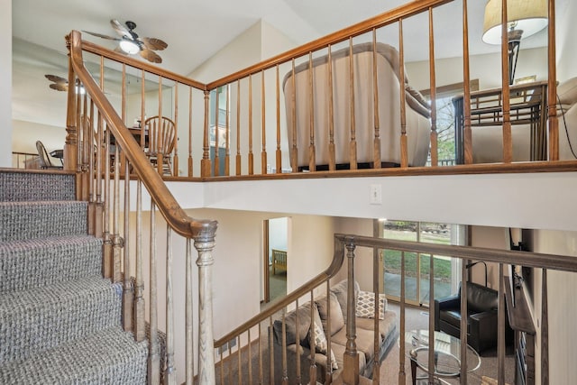 stairs featuring a towering ceiling