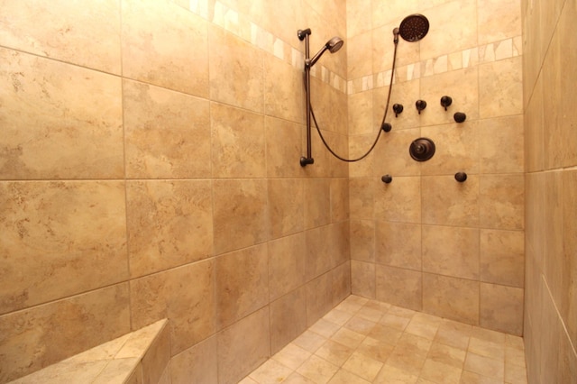 bathroom with a tile shower