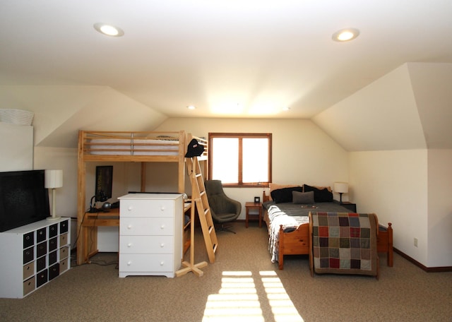 bedroom with carpet flooring and vaulted ceiling