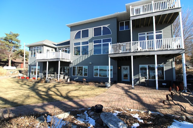 back of house with a patio