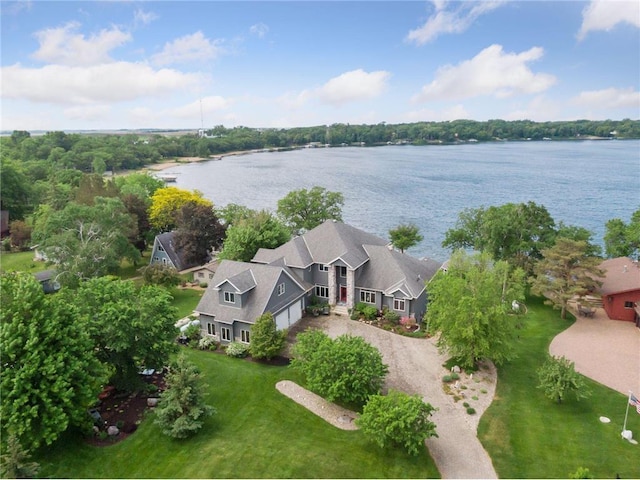 birds eye view of property with a water view