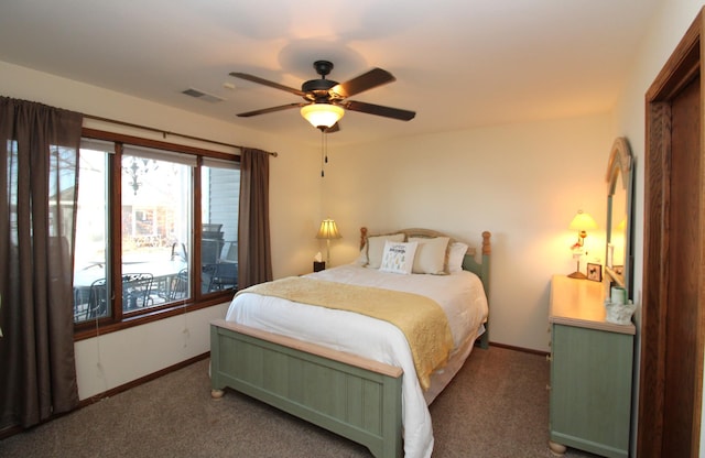 carpeted bedroom featuring visible vents, a ceiling fan, and baseboards