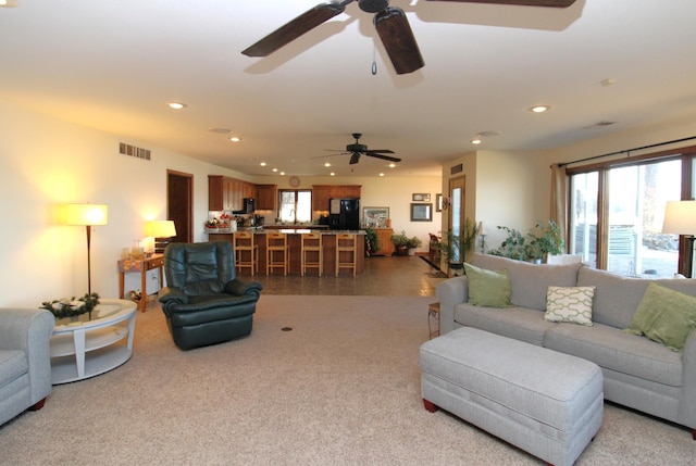 19699 623rd Ave, Litchfield, MN 55355 - carpeted living area with ceiling fan and recessed lighting