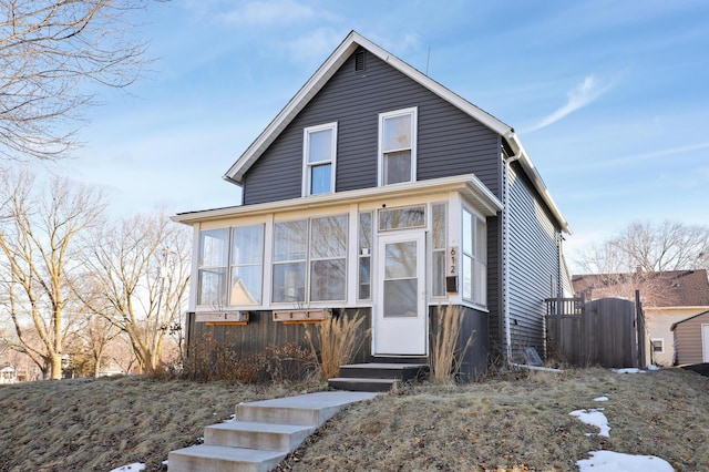 view of front of property featuring a sunroom