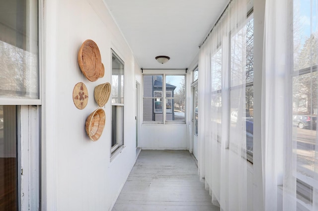 corridor featuring light hardwood / wood-style floors