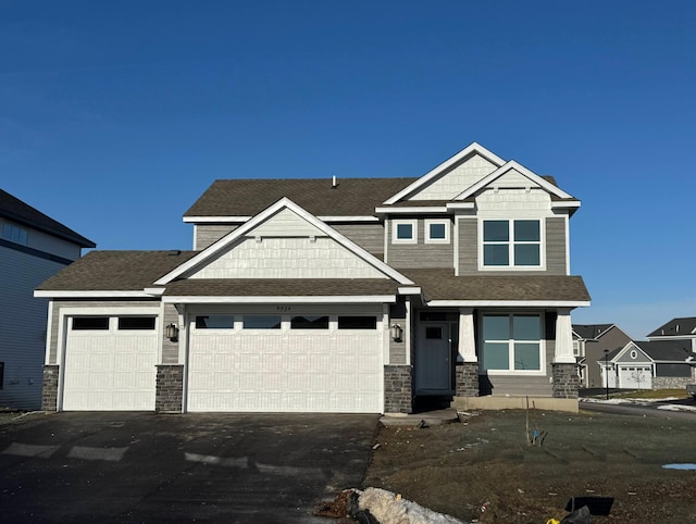 craftsman inspired home featuring a garage