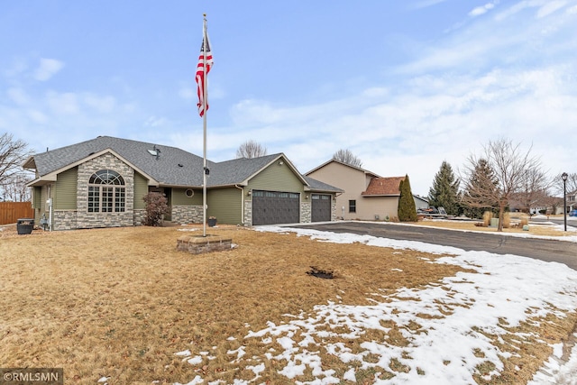 ranch-style house featuring a garage