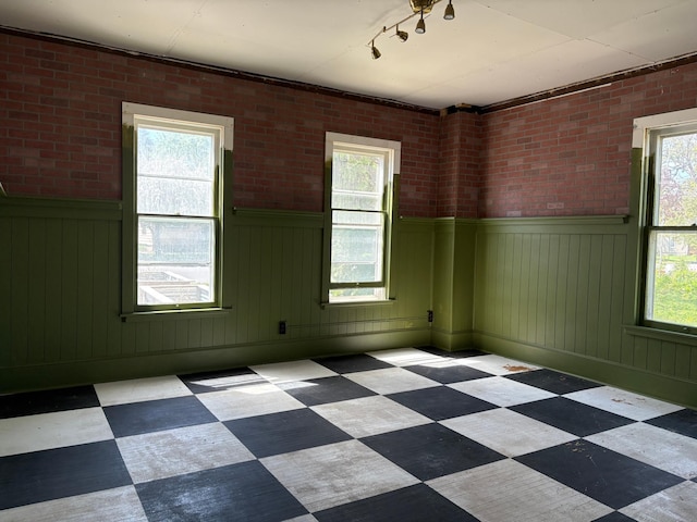 20 1st Ave NW, Plainview, MN 55964 - empty room with tile patterned floors and a wainscoted wall