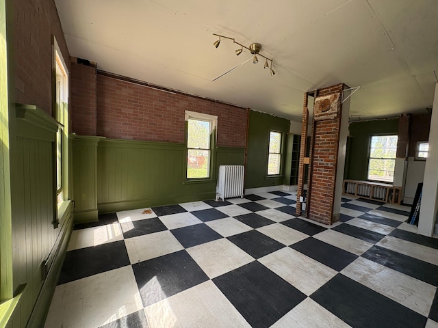 20 1st Ave NW, Plainview, MN 55964 - unfurnished room with tile patterned floors, plenty of natural light, and wainscoting