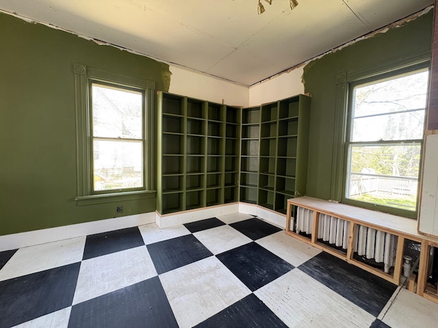 20 1st Ave NW, Plainview, MN 55964 - empty room featuring tile patterned floors and healthy amount of natural light