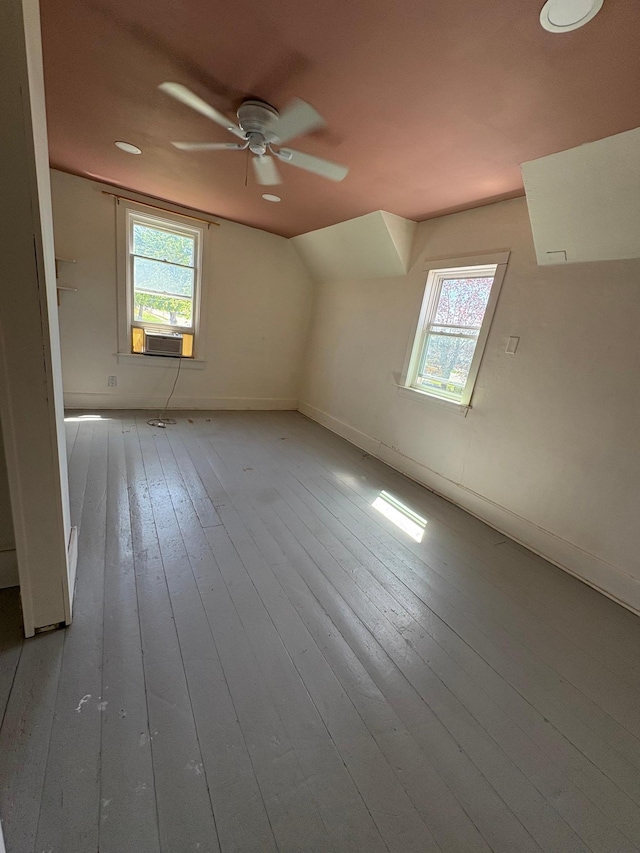 20 1st Ave NW, Plainview, MN 55964 - additional living space with ceiling fan, light wood finished floors, baseboards, lofted ceiling, and cooling unit