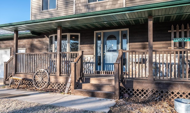 property entrance with covered porch