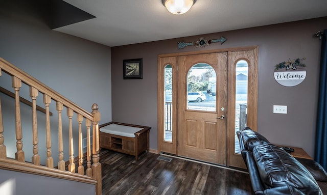 entrance foyer with dark hardwood / wood-style floors