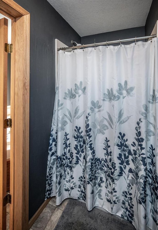 bathroom with a textured ceiling