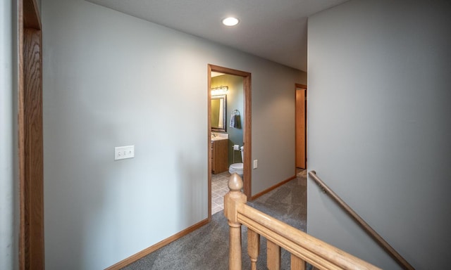 hallway featuring carpet floors