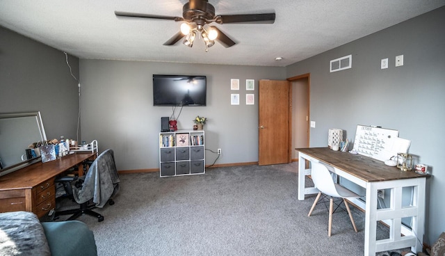 office space featuring ceiling fan, light carpet, and a textured ceiling