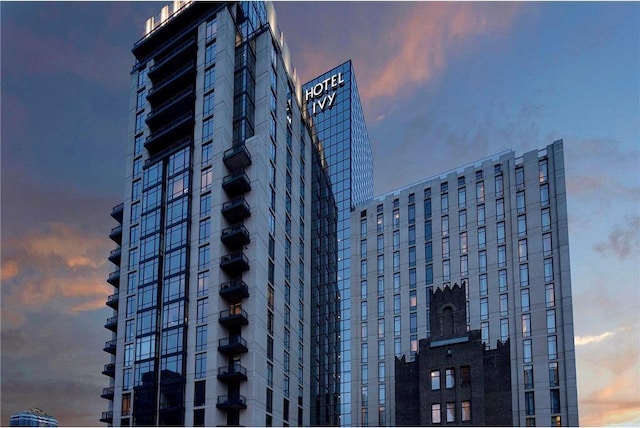 view of outdoor building at dusk