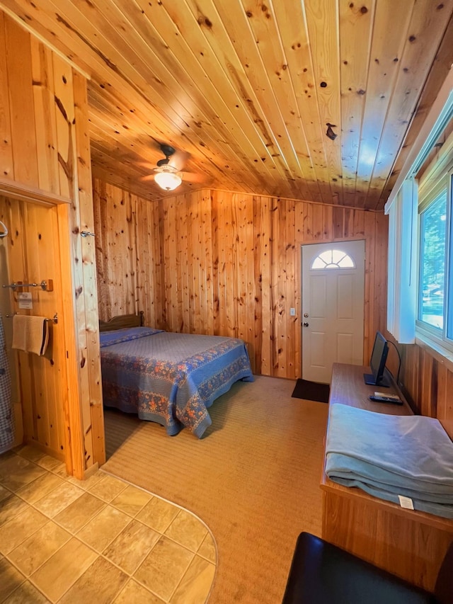 bedroom featuring wood ceiling, carpet, and wood walls