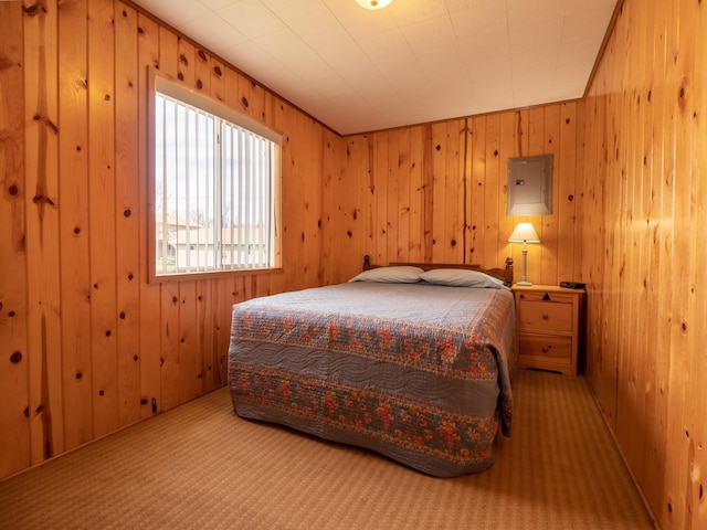 carpeted bedroom featuring wooden walls