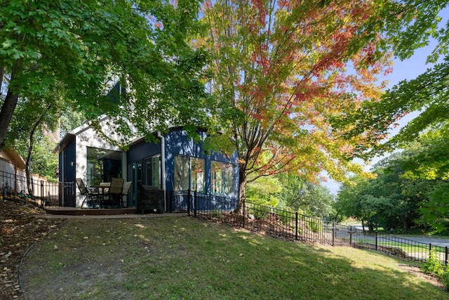 view of yard with fence and a wooden deck