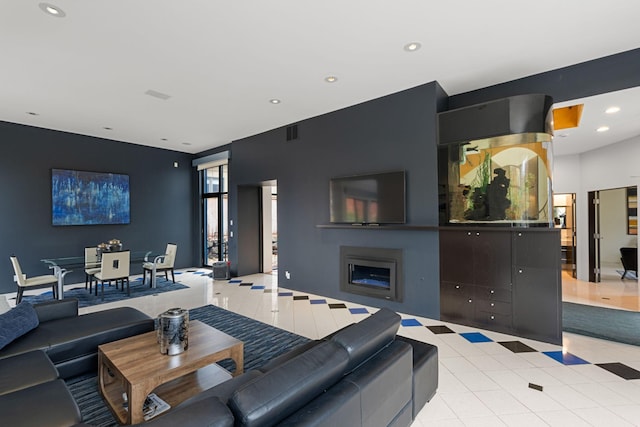 living area featuring light tile patterned flooring, a fireplace, visible vents, and recessed lighting