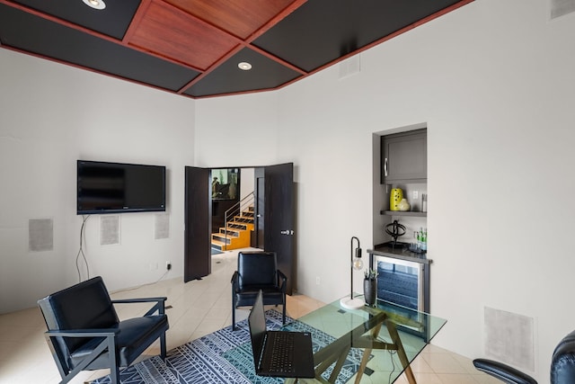 office featuring a bar, light tile patterned floors, and recessed lighting