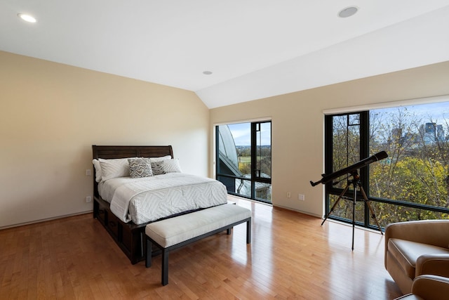 bedroom featuring lofted ceiling, access to outside, recessed lighting, and light wood-style floors