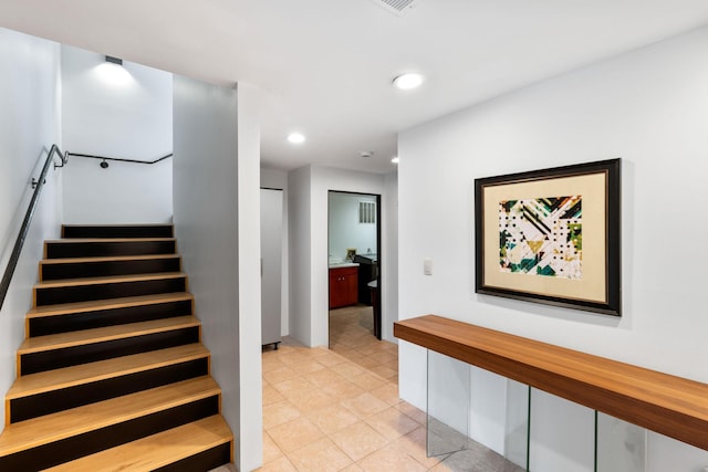 stairs with tile patterned flooring and recessed lighting