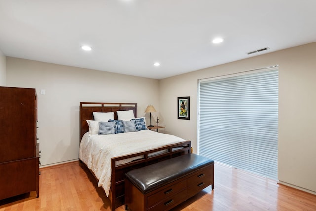 bedroom with recessed lighting, visible vents, and light wood-style flooring