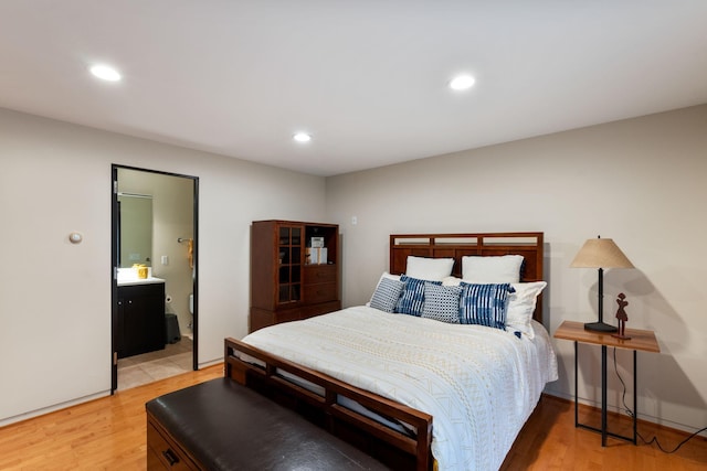 bedroom with light wood-type flooring and recessed lighting