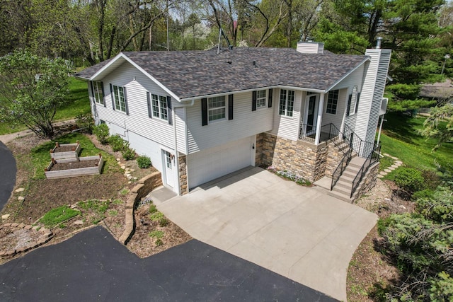 split foyer home featuring a garage